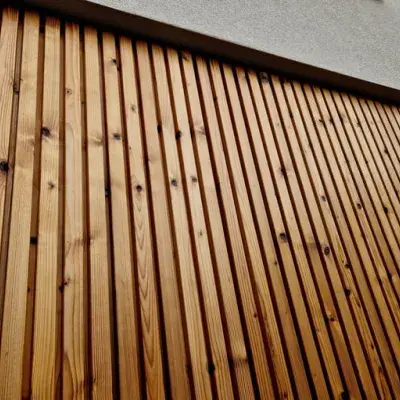 Wooden paneling on the garden house from a metal container