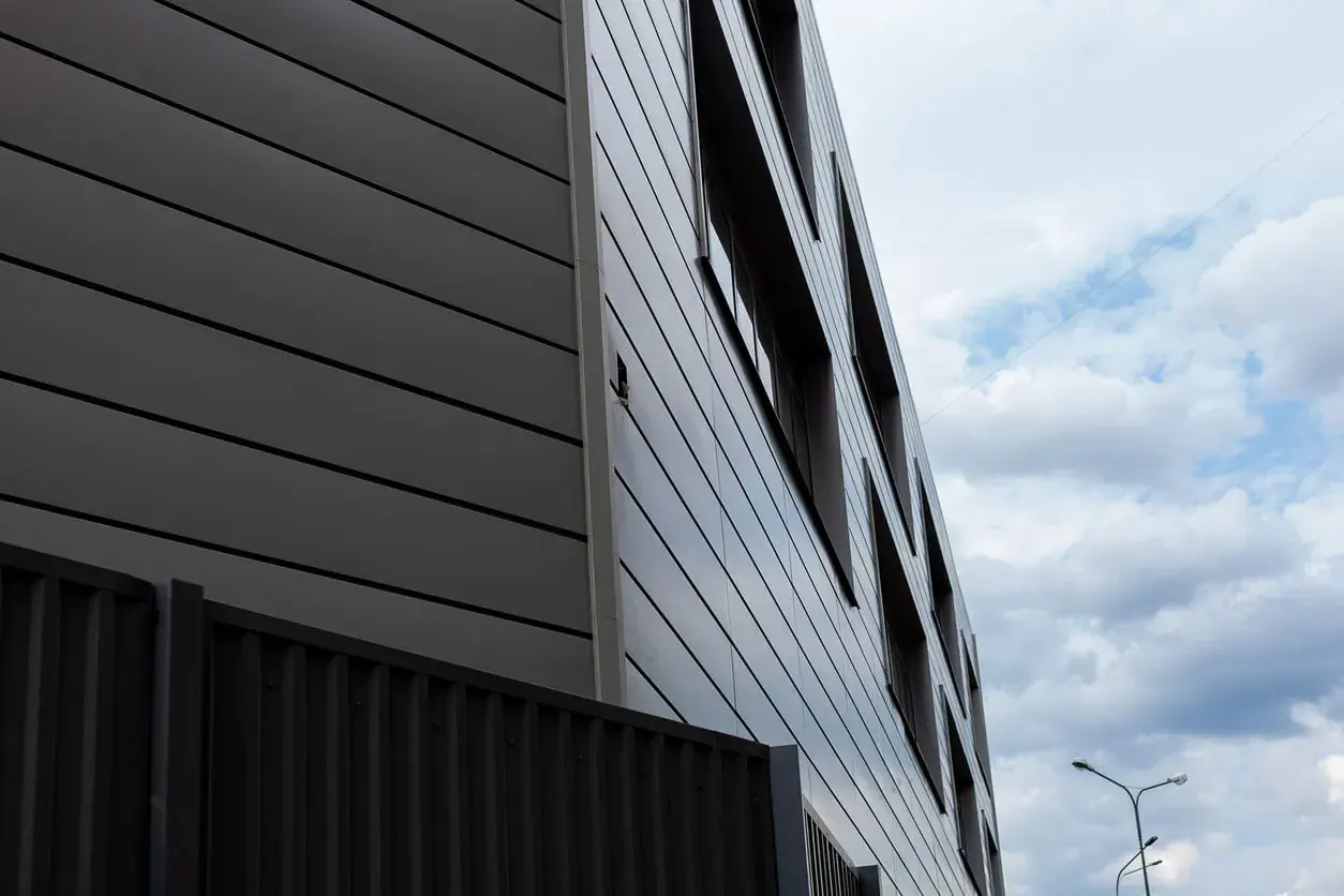 The facade of the building on the background of clouds