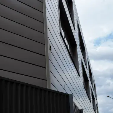The facade of the building on the background of clouds